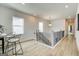 Light-filled upstairs hallway with wood floors and modern railing at 43 Avian Way # 3B, Auburn, GA 30011