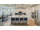 Bright kitchen with white cabinets, large island with seating and stainless steel appliances at 43 Avian Way # 3B, Auburn, GA 30011