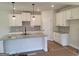 Bright kitchen with white cabinets, granite countertops, and stainless steel appliances at 43 Avian Way # 3B, Auburn, GA 30011