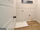 The laundry room features a laundry sink and a shelf for storage at 43 Avian Way # 3B, Auburn, GA 30011