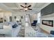 Bright living room featuring coffered ceilings, fireplace, and open floor plan to the staircase at 43 Avian Way # 3B, Auburn, GA 30011