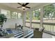 Covered outdoor space with ceiling fan and wicker seating that is great for enjoying the outdoors at 43 Avian Way # 3B, Auburn, GA 30011