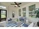 Cozy screened porch with wicker furniture, perfect for relaxing outdoors at 43 Avian Way # 3B, Auburn, GA 30011