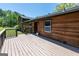 Spacious back deck perfect for entertaining, with wood railings and access to the home's entrance at 1919 101 S Hwy, Temple, GA 30179