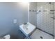 Bathroom featuring a tiled shower, with a pedestal sink and wood-look flooring at 1919 101 S Hwy, Temple, GA 30179