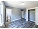 Bedroom featuring two closets, access to a bathroom, and a window for natural light at 1919 101 S Hwy, Temple, GA 30179