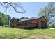 Exterior view of a house showing the wooden deck and partially bricked section of the house at 1919 101 S Hwy, Temple, GA 30179