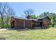 Beautiful two-story home with a combination of wood and brick exterior, large front yard, and inviting porch at 1919 101 S Hwy, Temple, GA 30179