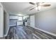 Bright kitchen with white cabinets, stainless steel appliances and wood-look floors at 1919 101 S Hwy, Temple, GA 30179