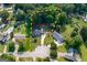 Aerial view of the property with backyard football field, outlined property lines, and surrounding greenery at 870 Rutherford Dr, Dacula, GA 30019