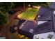 Aerial shot showcasing the backyard football field, spacious deck, and cozy fire pit at 870 Rutherford Dr, Dacula, GA 30019