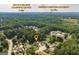 An aerial view shows the proximity of this home to Dacula Village Shopping Center and Hebron Christian Academy at 870 Rutherford Dr, Dacula, GA 30019