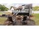 Landscaped backyard with a stone fire pit and seating area, perfect for outdoor entertaining at 870 Rutherford Dr, Dacula, GA 30019