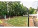 Backyard featuring an expansive football field and playground area, perfect for outdoor activities and fun at 870 Rutherford Dr, Dacula, GA 30019