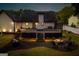 Backyard area featuring a custom-built football field, a fire pit, and a spacious deck at 870 Rutherford Dr, Dacula, GA 30019