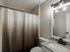 Bathroom features a vanity with granite counters, neutral paint, and a shower with curtain at 870 Rutherford Dr, Dacula, GA 30019
