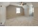 Spacious bedroom with neutral carpet, a ceiling fan, and multiple windows for great light at 870 Rutherford Dr, Dacula, GA 30019