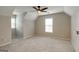 Neutral bedroom features plush carpeting and ample natural light from two windows at 870 Rutherford Dr, Dacula, GA 30019