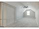 Spacious bedroom featuring a ceiling fan, large window, and closet at 870 Rutherford Dr, Dacula, GA 30019