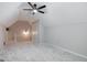Bright bonus room features neutral paint, carpet, ceiling fan and dormer window at 870 Rutherford Dr, Dacula, GA 30019