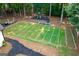 Aerial view of backyard with football field, playground and wooded surroundings at 870 Rutherford Dr, Dacula, GA 30019