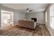 Modern living room featuring a fireplace and light colored wood floor at 870 Rutherford Dr, Dacula, GA 30019