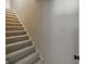 Carpeted staircase leading to the upper level of the home at 870 Rutherford Dr, Dacula, GA 30019