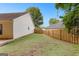 Spacious backyard featuring a lawn and a wooden fence, providing privacy at 11765 Fairway Overlook, Fayetteville, GA 30215
