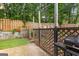 Outdoor patio area featuring a grill and overhead string lights for ambiance at 11765 Fairway Overlook, Fayetteville, GA 30215