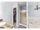 Relaxing bathroom with a jacuzzi tub and separate shower at 11765 Fairway Overlook, Fayetteville, GA 30215