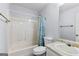 Well-lit bathroom featuring a shower-tub combination, white toilet, and sink at 11765 Fairway Overlook, Fayetteville, GA 30215
