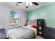 Cozy bedroom with ceiling fan and natural light at 11765 Fairway Overlook, Fayetteville, GA 30215