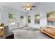 Bonus room with a ceiling fan, multiple windows and lots of natural light at 11765 Fairway Overlook, Fayetteville, GA 30215
