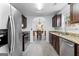 Kitchen with stainless steel appliances, granite countertops and a tile backsplash at 11765 Fairway Overlook, Fayetteville, GA 30215