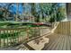 Newly built wooden deck with railing overlooking a lush green backyard with mature trees at 1226 Byewood Sw Ln, Atlanta, GA 30310