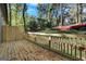 New backyard wooden deck and rail offers a place to enjoy the treed lot at 1226 Byewood Sw Ln, Atlanta, GA 30310