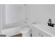 Clean bathroom featuring a white subway tile shower, toilet, and modern gray vanity at 1226 Byewood Sw Ln, Atlanta, GA 30310