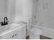 Bathroom with a white vanity, toilet, and tiled shower/tub combo at 1226 Byewood Sw Ln, Atlanta, GA 30310