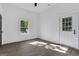 Bright, airy bedroom featuring natural light from a window and a glass paneled door at 1226 Byewood Sw Ln, Atlanta, GA 30310