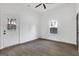 Bright bedroom with a ceiling fan, window, door to the outside, and new floors at 1226 Byewood Sw Ln, Atlanta, GA 30310