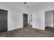 Bedroom featuring new hardwood floors, a dark interior door, and view to a bath and kitchen at 1226 Byewood Sw Ln, Atlanta, GA 30310