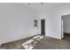 Spacious bedroom with a rear entrance door, a window, and modern flooring at 1226 Byewood Sw Ln, Atlanta, GA 30310