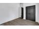 Bright bedroom with closet and open doorway, highlighting modern flooring and clean, white trim at 1226 Byewood Sw Ln, Atlanta, GA 30310