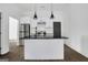 Spacious kitchen featuring white cabinets, black hardware, stainless appliances and a center island at 1226 Byewood Sw Ln, Atlanta, GA 30310