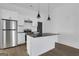 Modern kitchen with stainless steel appliances, white cabinets and black granite island at 1226 Byewood Sw Ln, Atlanta, GA 30310