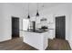 Modern kitchen featuring white cabinets, black hardware, subway tile backsplash and black granite island at 1226 Byewood Sw Ln, Atlanta, GA 30310