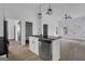 Bright kitchen with a center island that includes a sink, dishwasher, and modern pendant lights at 1226 Byewood Sw Ln, Atlanta, GA 30310