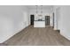 Open-concept living area with hardwood floors leading to the kitchen with stainless steel appliances at 1226 Byewood Sw Ln, Atlanta, GA 30310