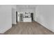 View of bright open living space with luxury vinyl plank floors and updated kitchen at 1226 Byewood Sw Ln, Atlanta, GA 30310