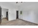 Bright living room with wood floors and views to the exterior and kitchen at 1226 Byewood Sw Ln, Atlanta, GA 30310